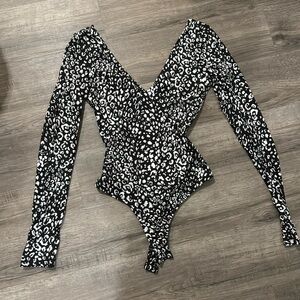 Lulu’s animal print black and white body suit size small